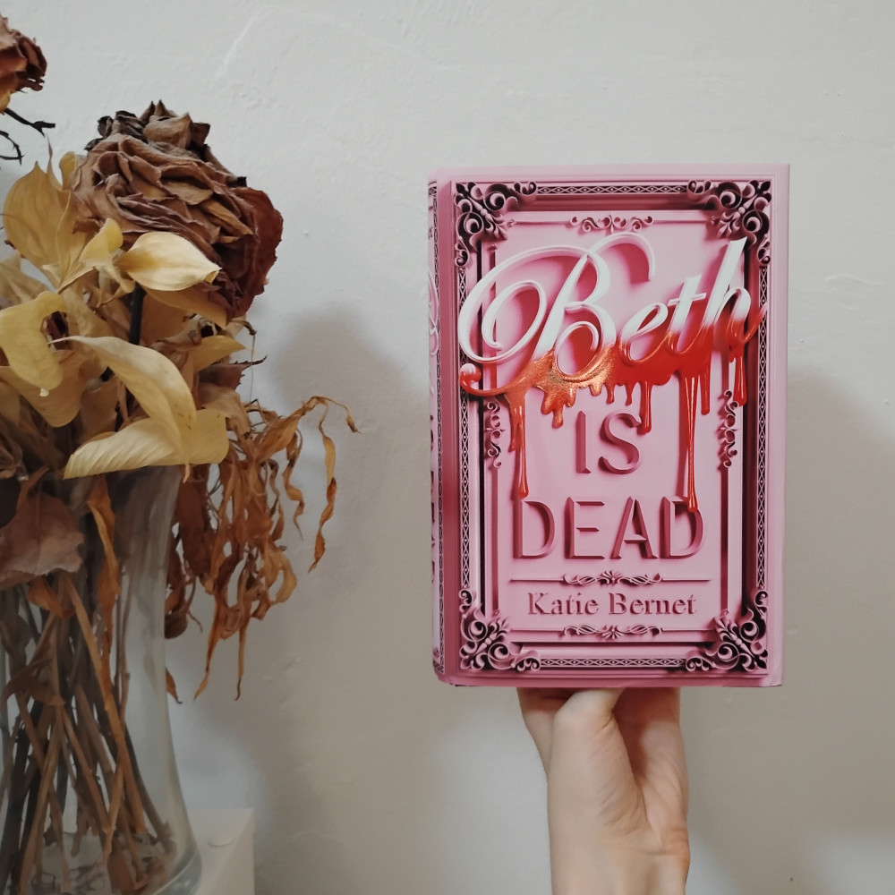 Beth is Dead by Katie Bernet hardcover. The dust jacket is very pink with big title text that has blood dripping from the name Beth.