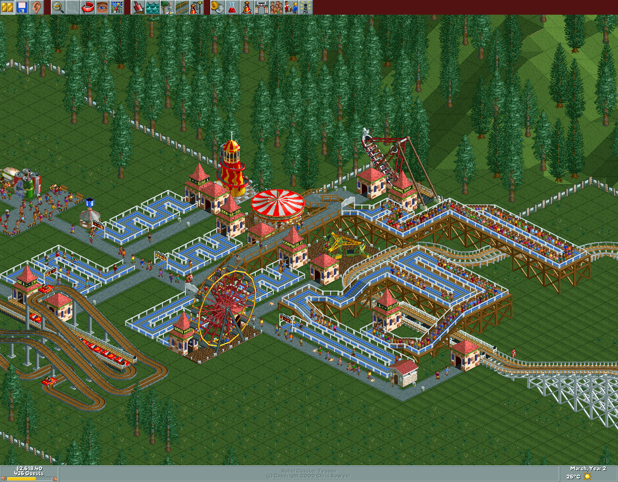 Rollercoaster Tycoon screenshot. Old school graphics. There's a swinging ship ride, a ferris wheel, a carousel, a big spiral slide, a spinny ride, a hint of rollercoaster, and a bunch of people in queues.