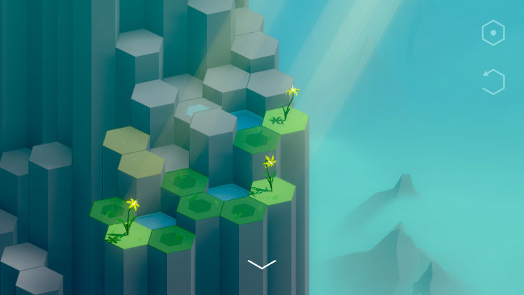 Screenshot from Spring Falls showing hexagonal blocks on a cliffside, some with grass, some holding water, and some with bright yellow flowers reaching toward the sun.